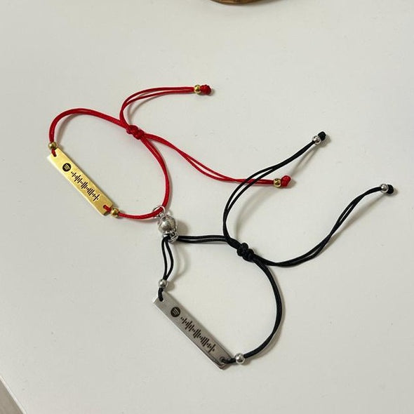 Confezione da 2 braccialetti rossi e neri con magnete